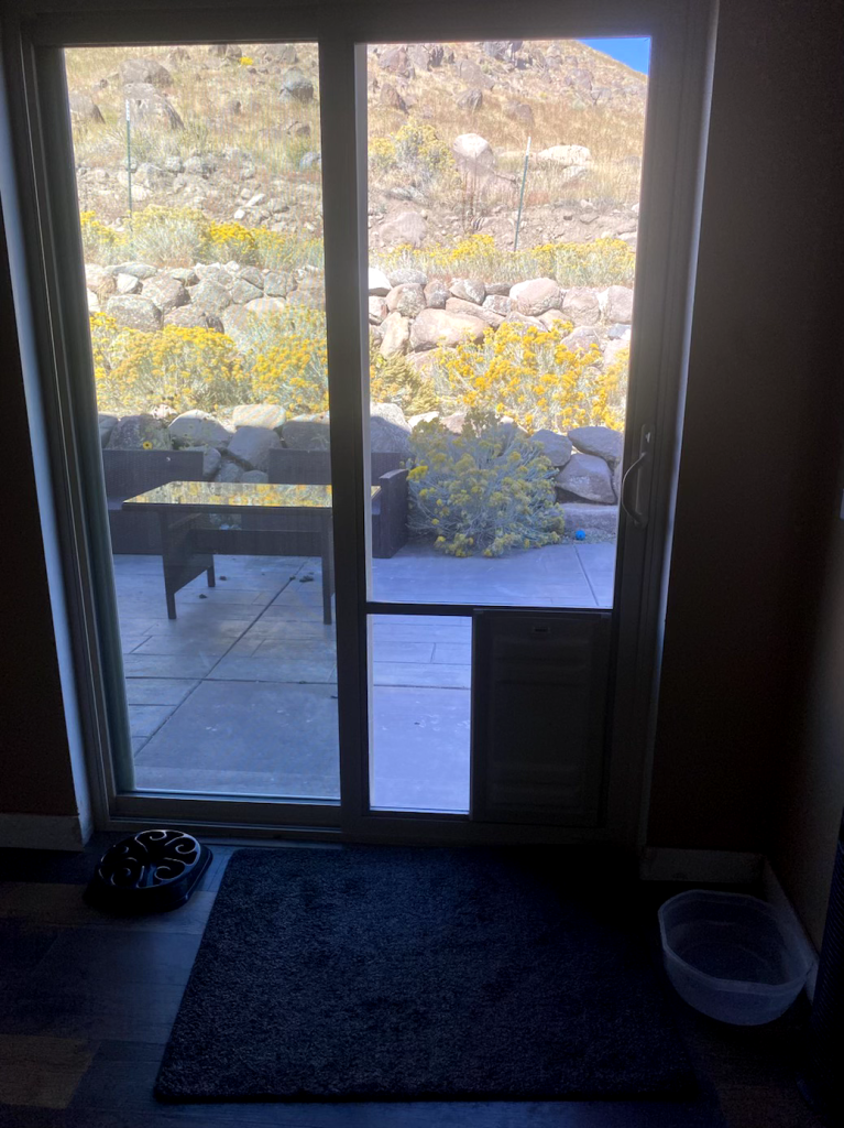 Sliding door with outdoor view.