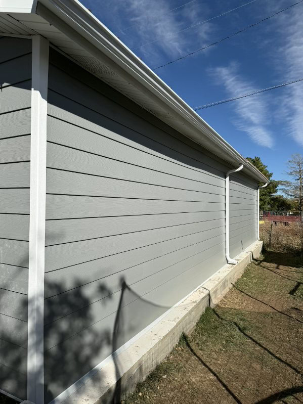 Gray house wall under blue sky