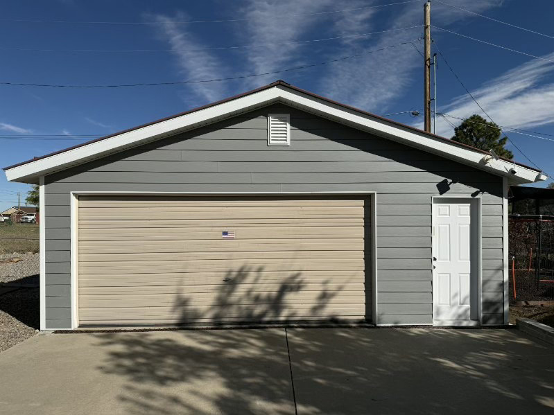 Gray garage with white door